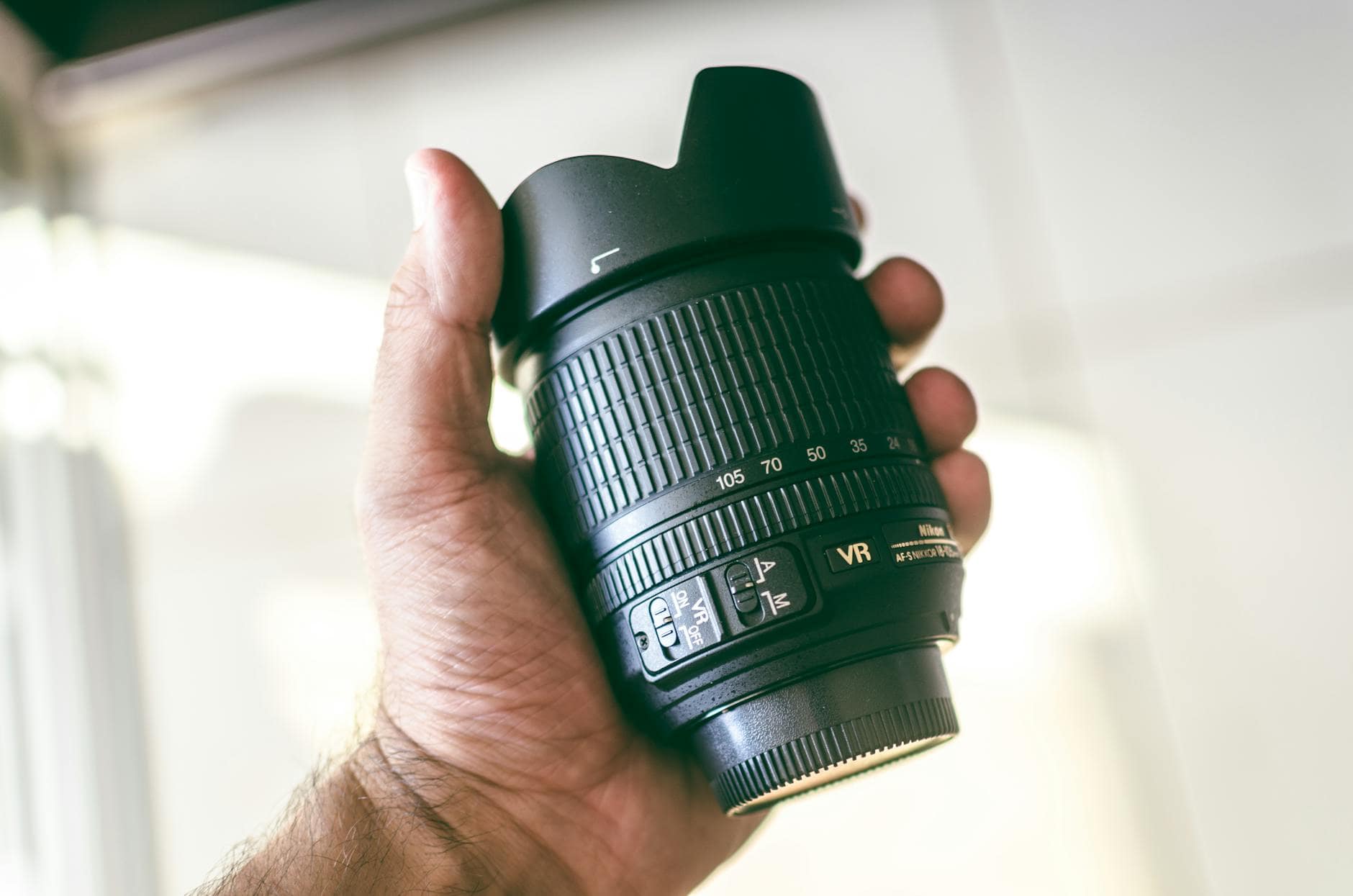 black nikon camera lens- essential gear for a landscape shot